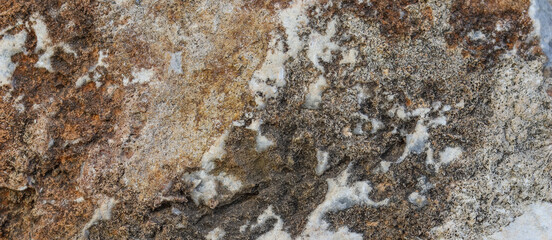 Natural brown gray stone as a background or texture, seamless for design. High quality photo