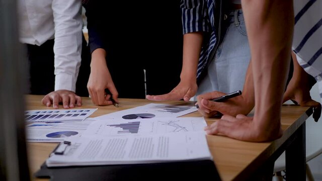 Business peoples meeting to analyze and discuss for situation on the marketing. Selected focus. 4K