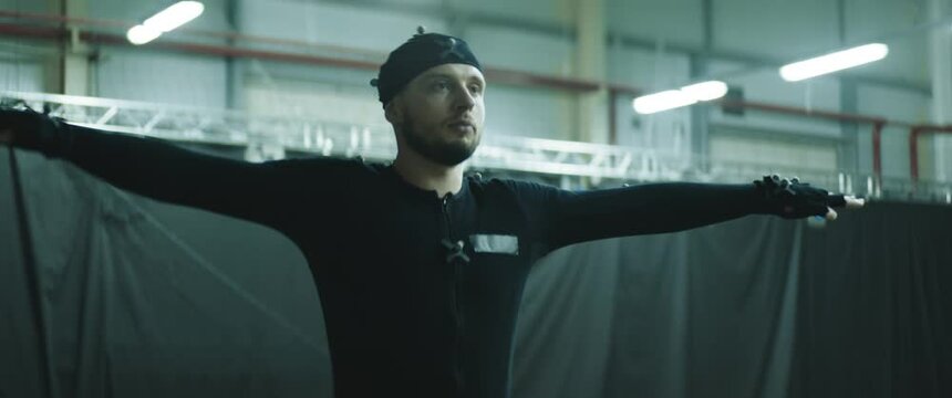 BTS of filmmaking. Actor is standing in T-pose for calibrating motion capture software. Motion capture is an unparalleled method for making animated characters move more realistically