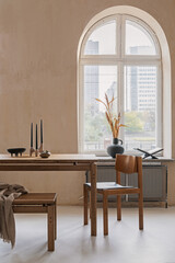 Elegant dining room interior composition with wooden dining table, armchair and design home decorations. Modern home staging. Rustic inspiration. Strucutre wall. Template. .