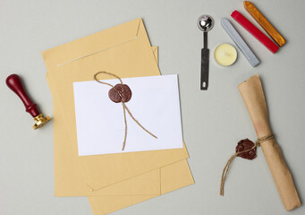 sealed white envelope with brown wax seal on beige background