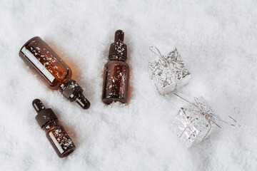 Glass bottles for serum in the snow