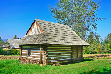 Fototapeta na wymiar A traditional Polish wooden house in ethnographic park in Nowy Sacz, Poland