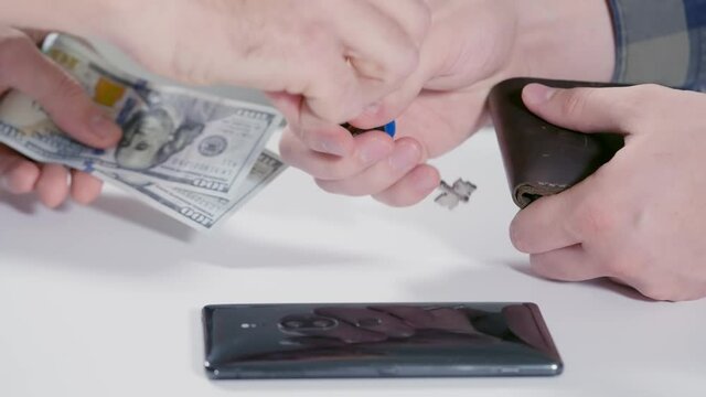 Bribe or backhander being paid in cash as a deal goes down