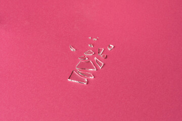 Fototapeta na wymiar Broken glass on pink background, deconstruction trend