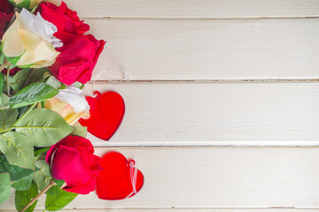 Wooden background with roses and hearts