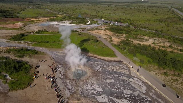 Aerial Cinematic footage of the Impressive Icelands Geysir Geisir in the Golden Circule, the geothermal activity and a attraction for tourists in Iceland	