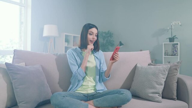 Lady millennial sit divan use gadget search web sale thoughts in apartment