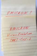 Text on piece of yellow paper about new variant of the Covid-19 Omicron B.1.1.529. New South...