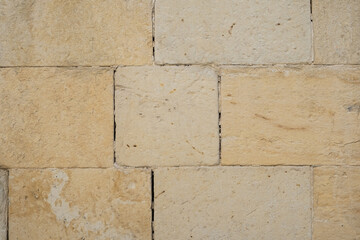 wall built with limestone blocks