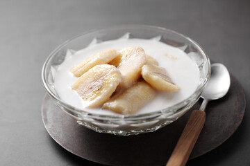 Thai dessert from banana and coconut milk in glass cup