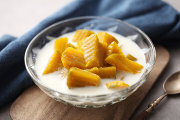 Thai dessert from pumpkin and coconut milk on tray