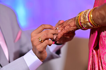 Engagement Ring ceremony, Indian wedding couple exchange rings ritual.