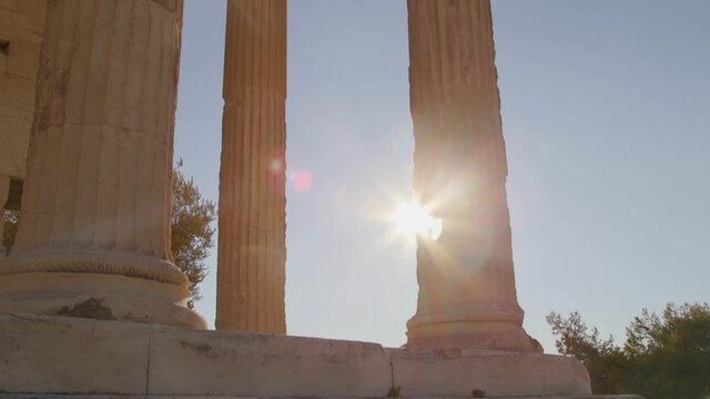 Detail shot of sun light through the columns of the Parthenon during sunset, at the Acropolis, Athens, Greece.