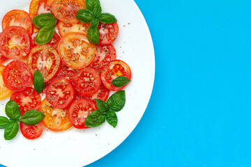 Tomato caprese salad, top view, close-up