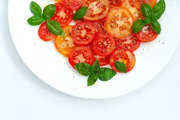 Tomato caprese salad, top view, close-up
