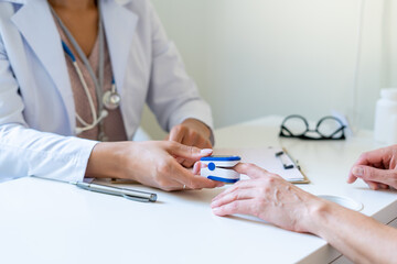 Cropped female doctor measuring oxygen saturation of anonymous patient with pulse oximeter