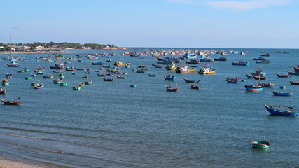 Fishing boats in the bay, on a sunny day.