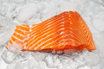 Fresh raw salmon steak on ice