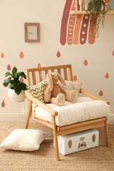 Child's room interior with rainbow painting on wall