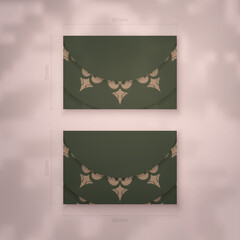 Presentable business card in green color with luxurious brown ornaments for your brand.