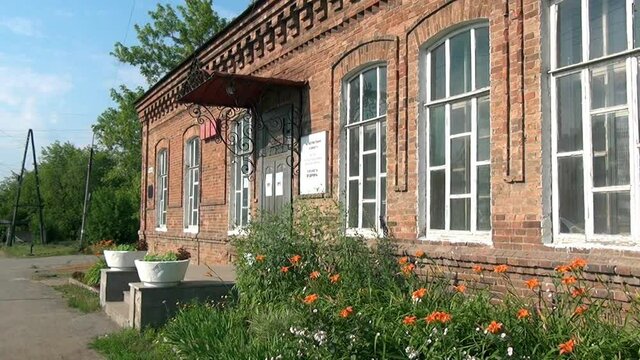 Alapaevsk, Russia - 17 July 2012: Windows of museum of Remembrance of Representatives of Russian Imperial House. Building, which contained relatives of Nicholas II before their execution.