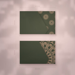 Presentable business card in green with Indian brown pattern for your brand.