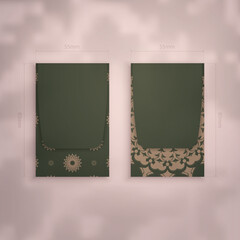 Presentable business card in green with vintage brown pattern for your business.