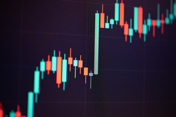 Abstract financial trading graphs and digital number of foreign exchange market trading on monitor. Background of gold and blue digital chart to represent stock market trend.	
