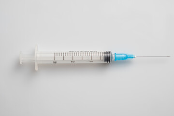Medical syringe on white background