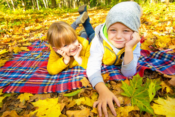 Two happy autumn children outside