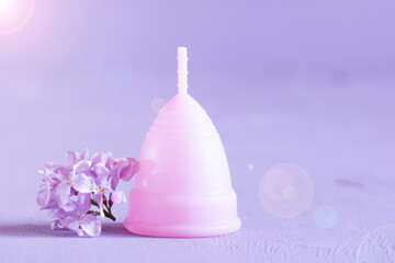 menstrual cup with light violet lilac flower