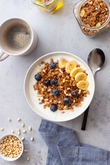 Granola with yogurt, blueberries, nuts, banana and honey. Muesli. Healthy eating. Vegetarian food.