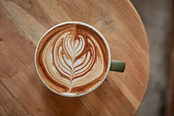 Selective focus cup of hot latte art coffee