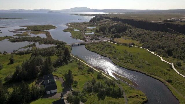Cinematic aerial footage of Thingvellir national park, Iceland's parliament, the Thingvellir Church and the ruins of old stone shelters, hikes and lake in the golden circule