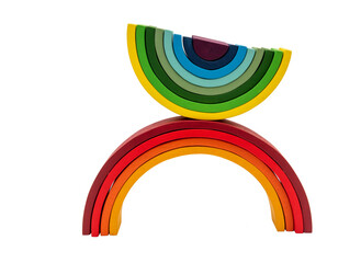 Wooden building toy in rainbow colors. 