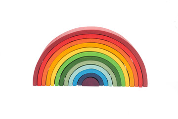 Wooden building toy in rainbow colors. 