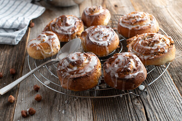 Cinnamon rolls with hazelnut filling on a cooling rack