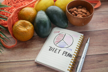 Diet plan with almond nuts and fresh fruit on table 