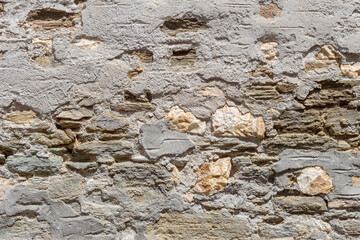 Gray painted grunge old wall close-up