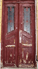 old shabby brown vintage entrance double door with glass