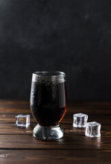 splashing sweet cola in a glass