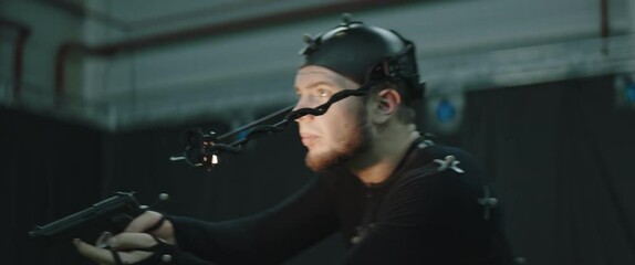 BTS Actor wearing motion capture suit acting as a game or animation movie character. Motion capture is an unparalleled method for making animated characters move more realistically