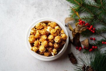 Caramel popcorn on holiday Xmas background, selective focus