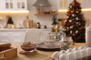 Ingredients on wooden table in kitchen. Making homemade Christmas cookies