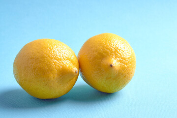 two lemons lie on a blue background