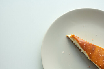 A slice of delicious cheese cake with caramel topping