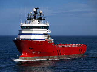 Offshore supply ship underway at sea.