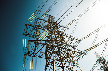 High voltage power lines support with many wires in daylight, energetics industry