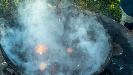 Mulled wine in a large cauldron. Mulled wine is cooked in a large pot. Vitamins in the traditional festival.